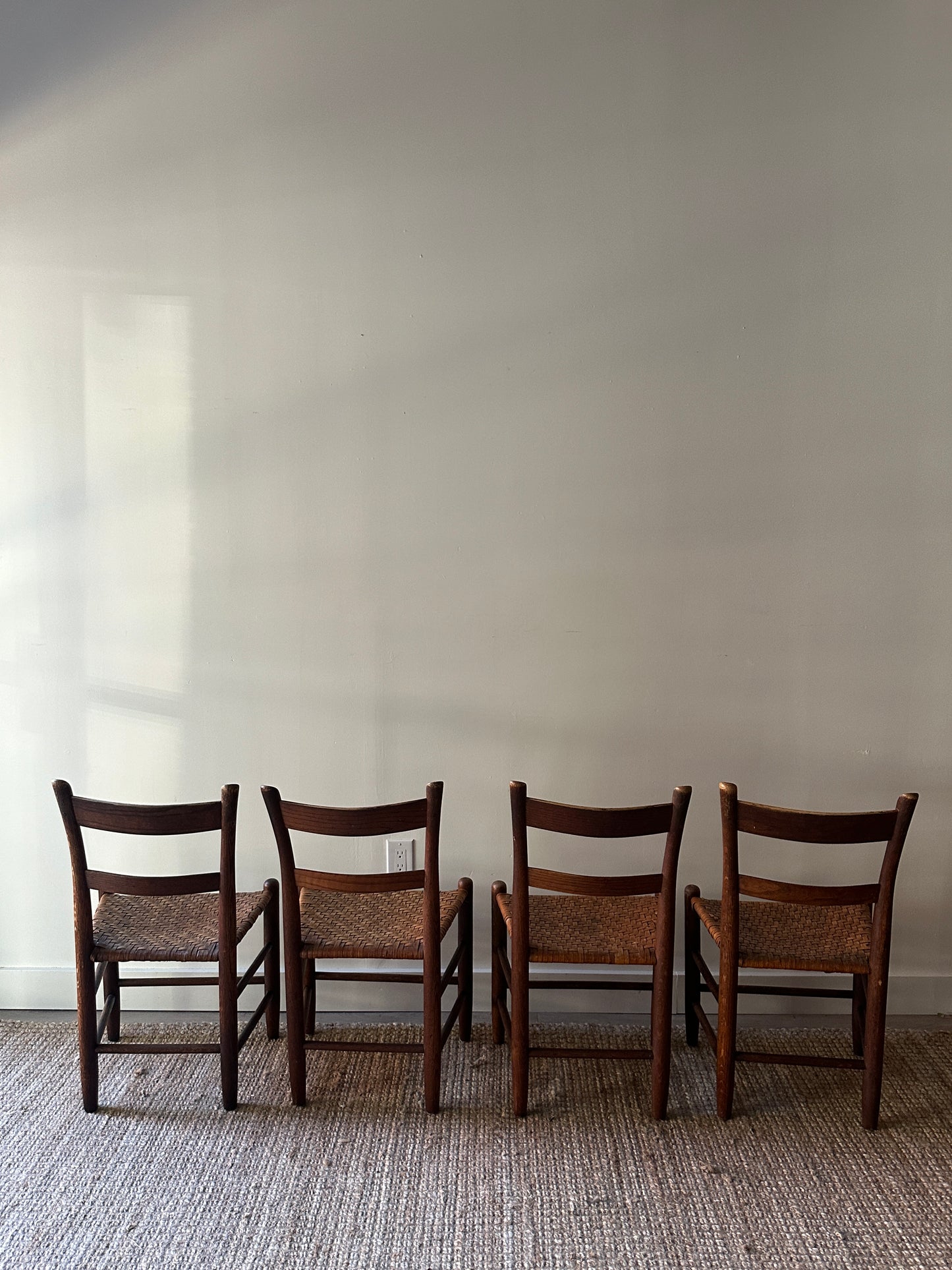 4 woven chairs. Sold individually.
