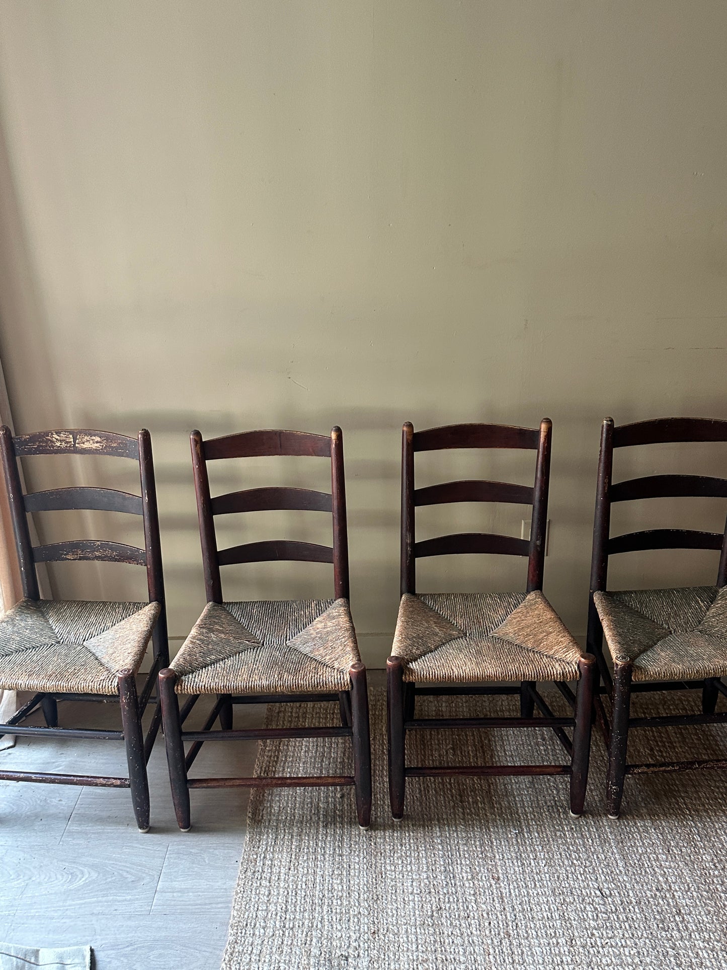 Ladder back rush seat chairs. Sold in pairs.