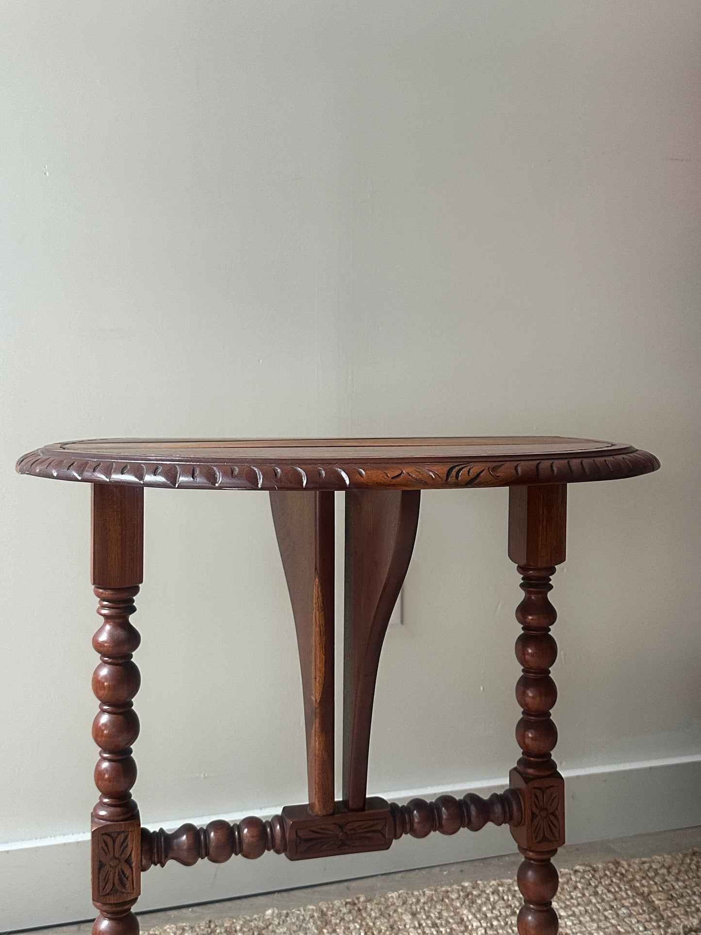 Carved drop leaf entryway table