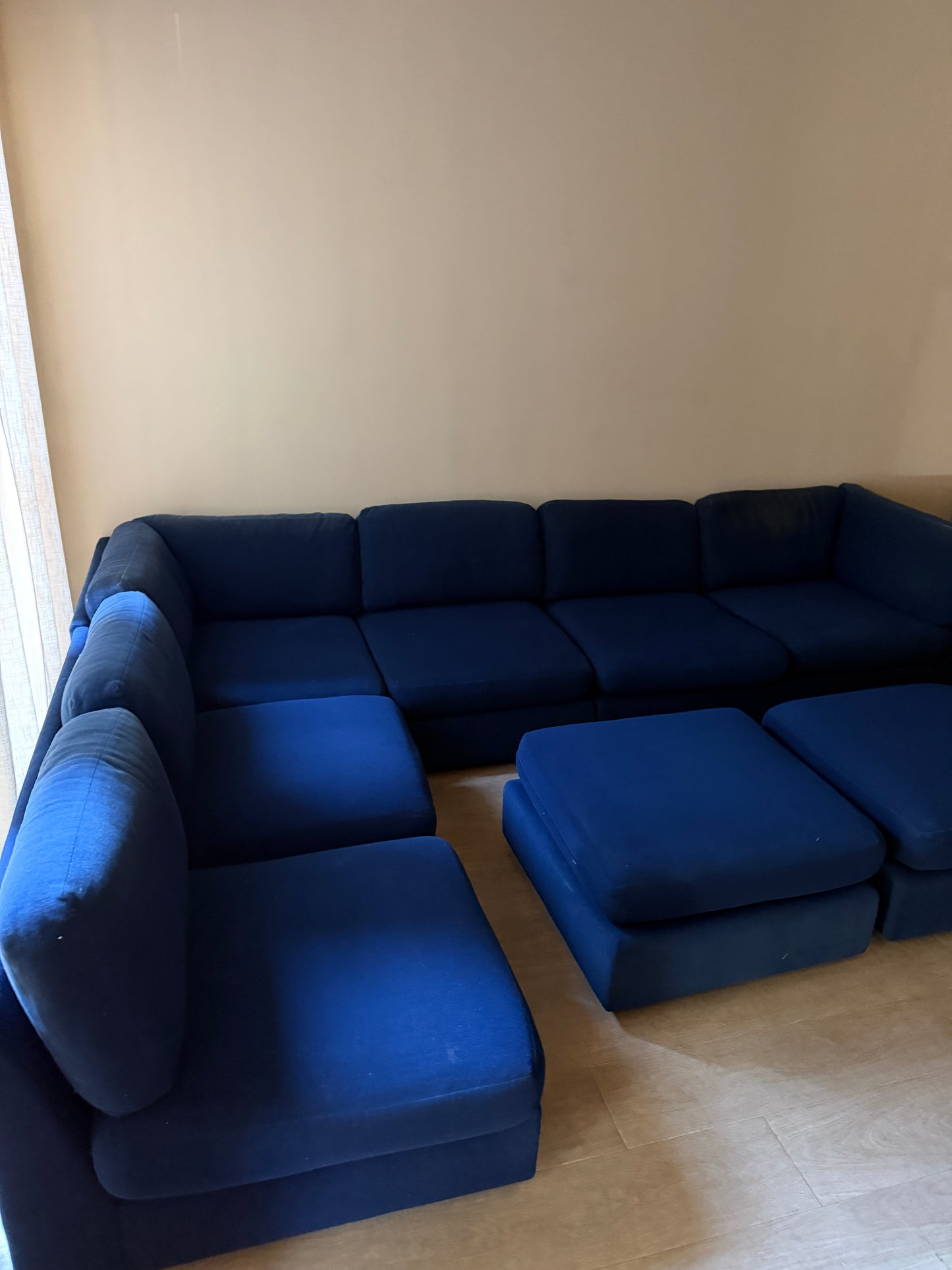 Sapphire blue modular sofa with ottomans