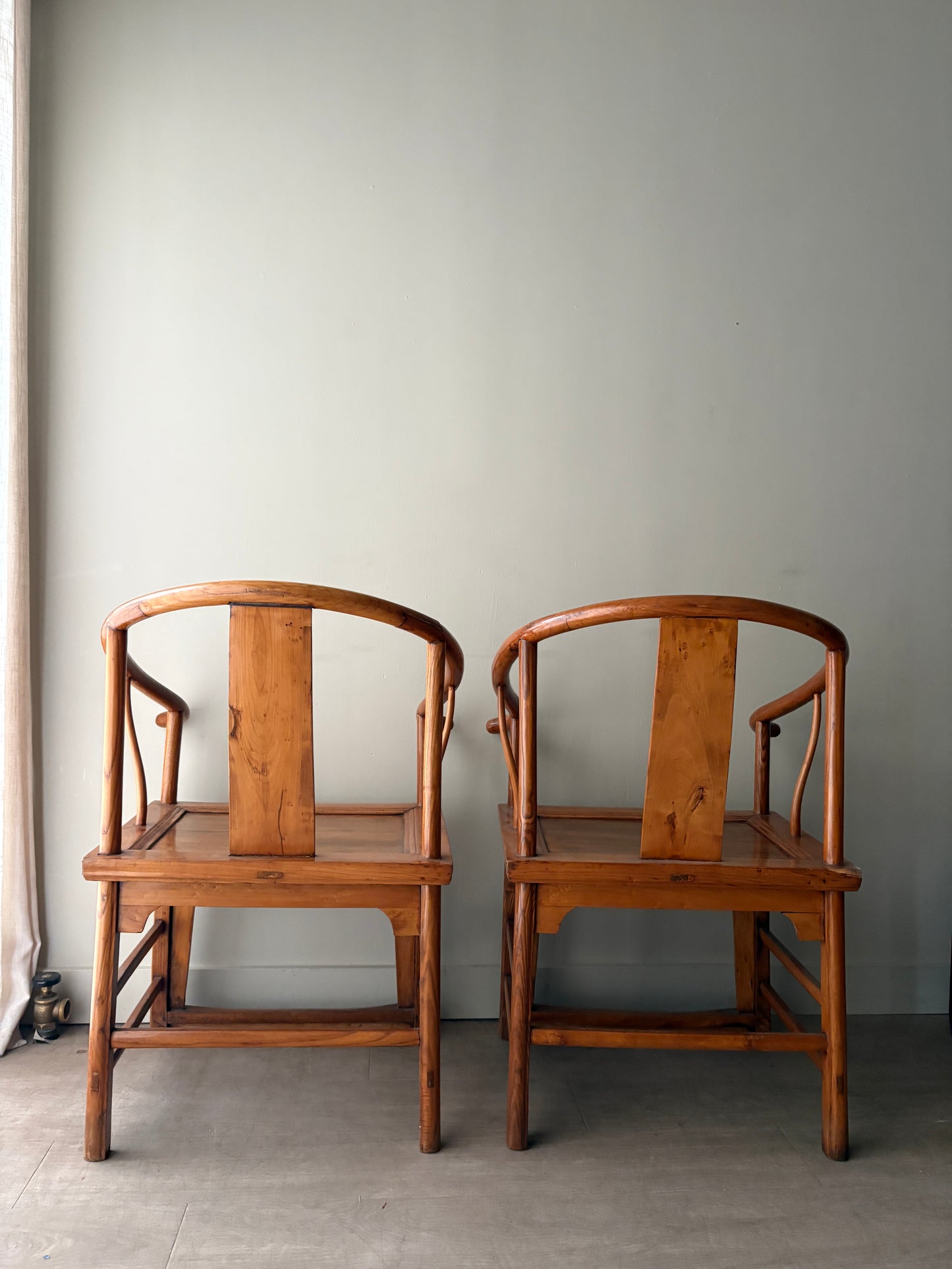 Chinese elmwood yoke back armchairs. Sold individually