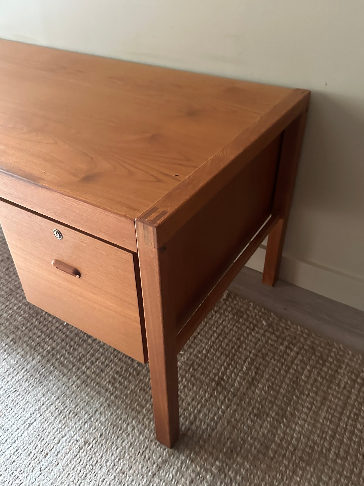 Teak desk. Right drawer locked.