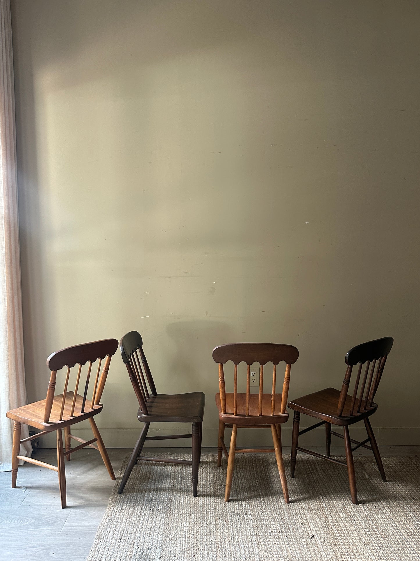 Scalloped mixed wood dining chairs. Sold in pairs.