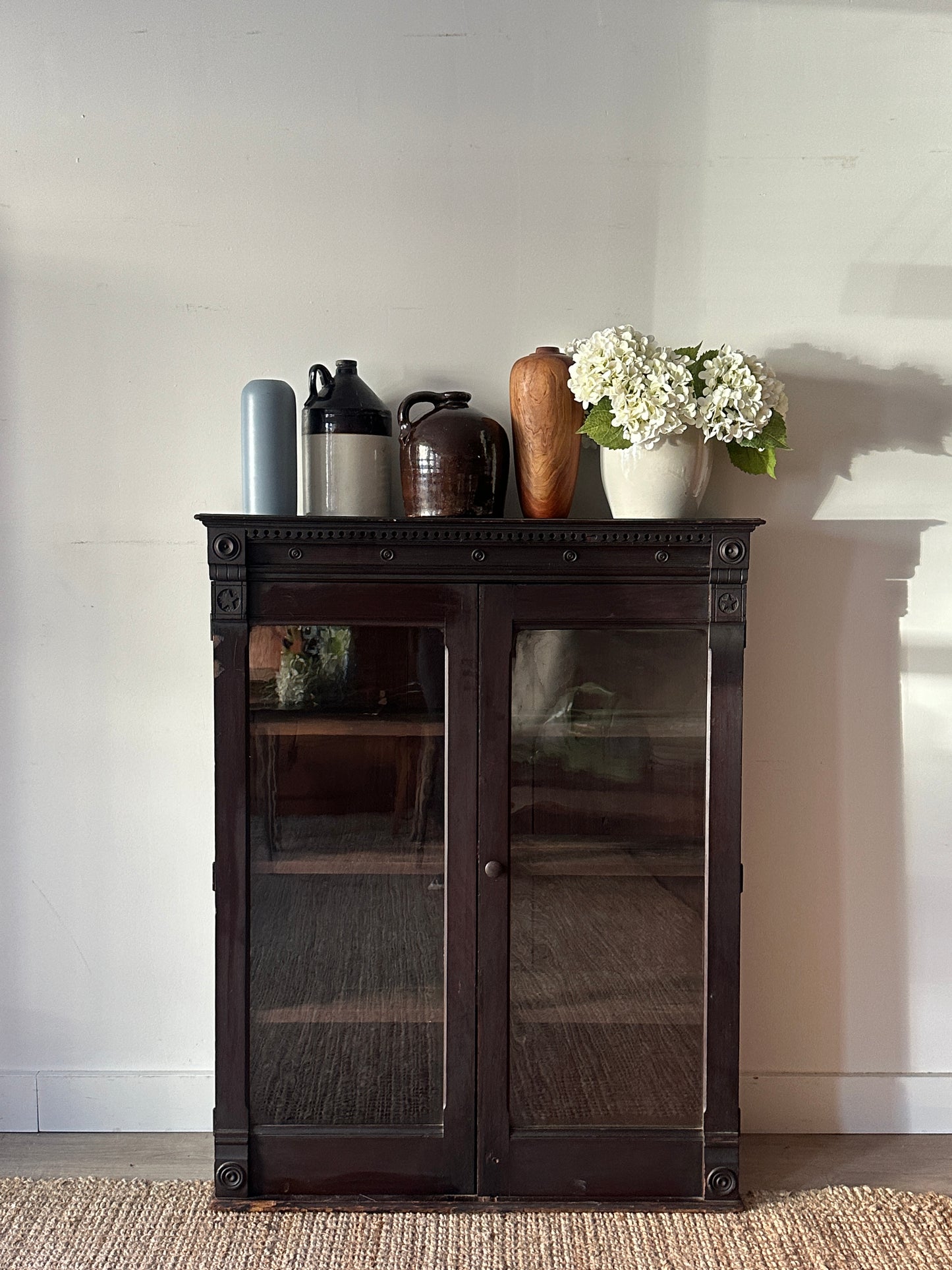 Carved mahogany display case