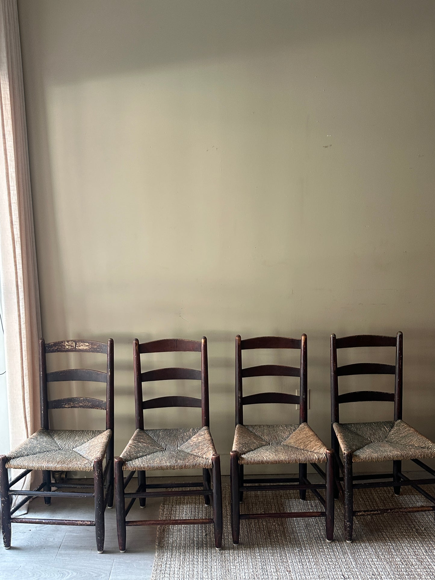 Ladder back rush seat chairs. Sold in pairs.