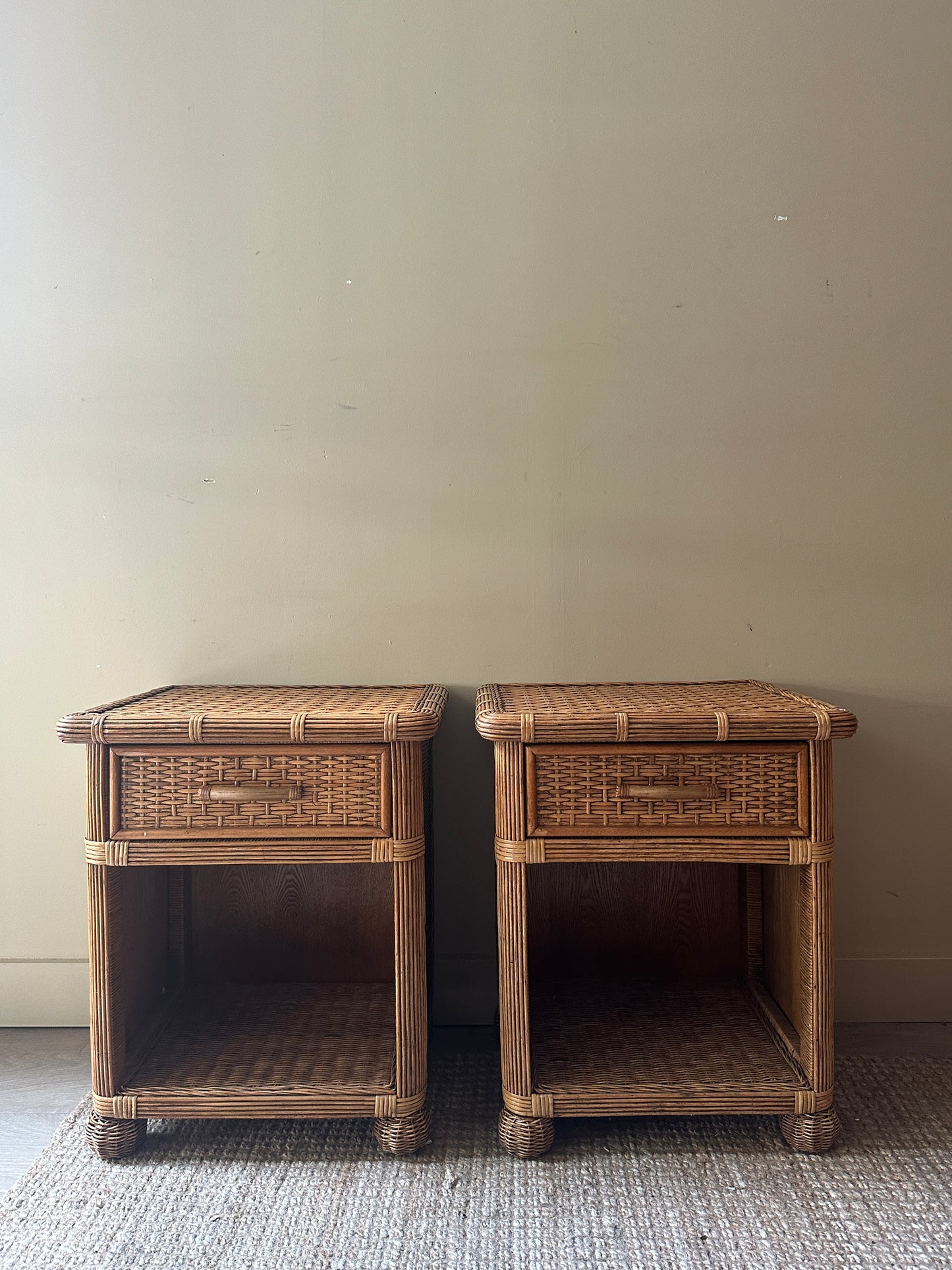 Wicker bedside tables. Sold individually.