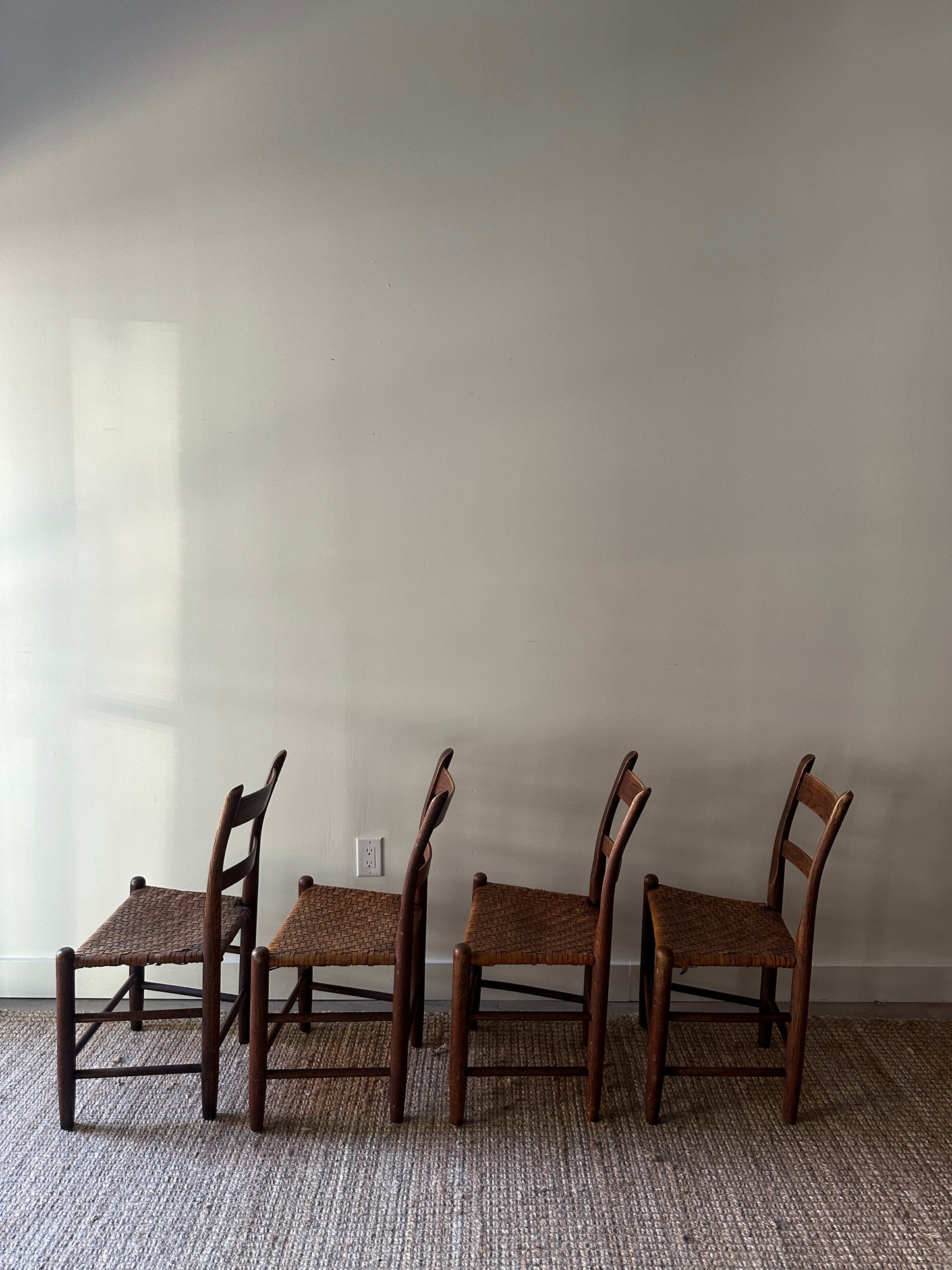 4 woven chairs. Sold individually.