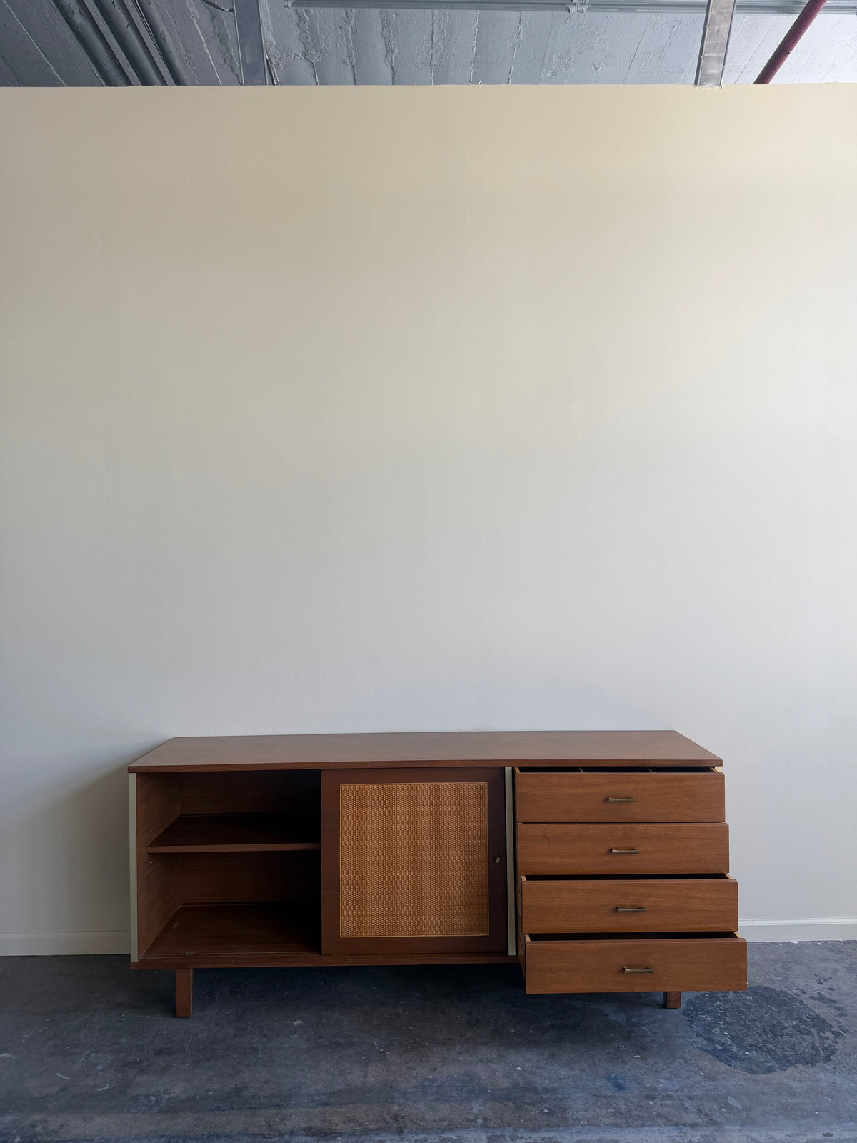 Walnut credenza with caned sliding doors