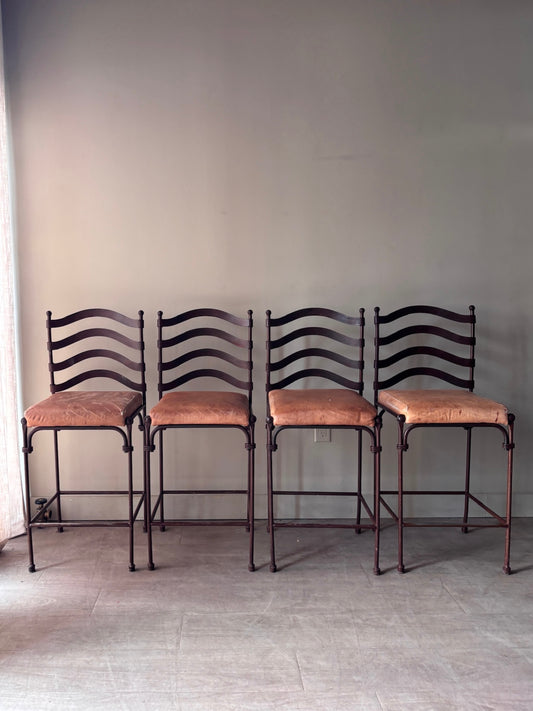 Wrought iron bar stools. Sold in sets of 2.