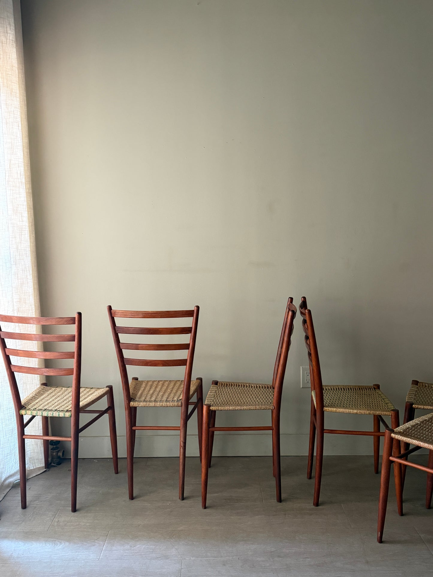 Chiavari Spinetto ladder back dining chairs with wicker cord seats. Sold as a set of 6.