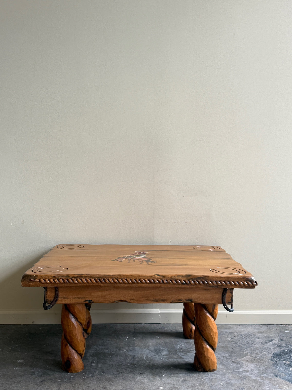 Pine coffee table with equestrian motifs
