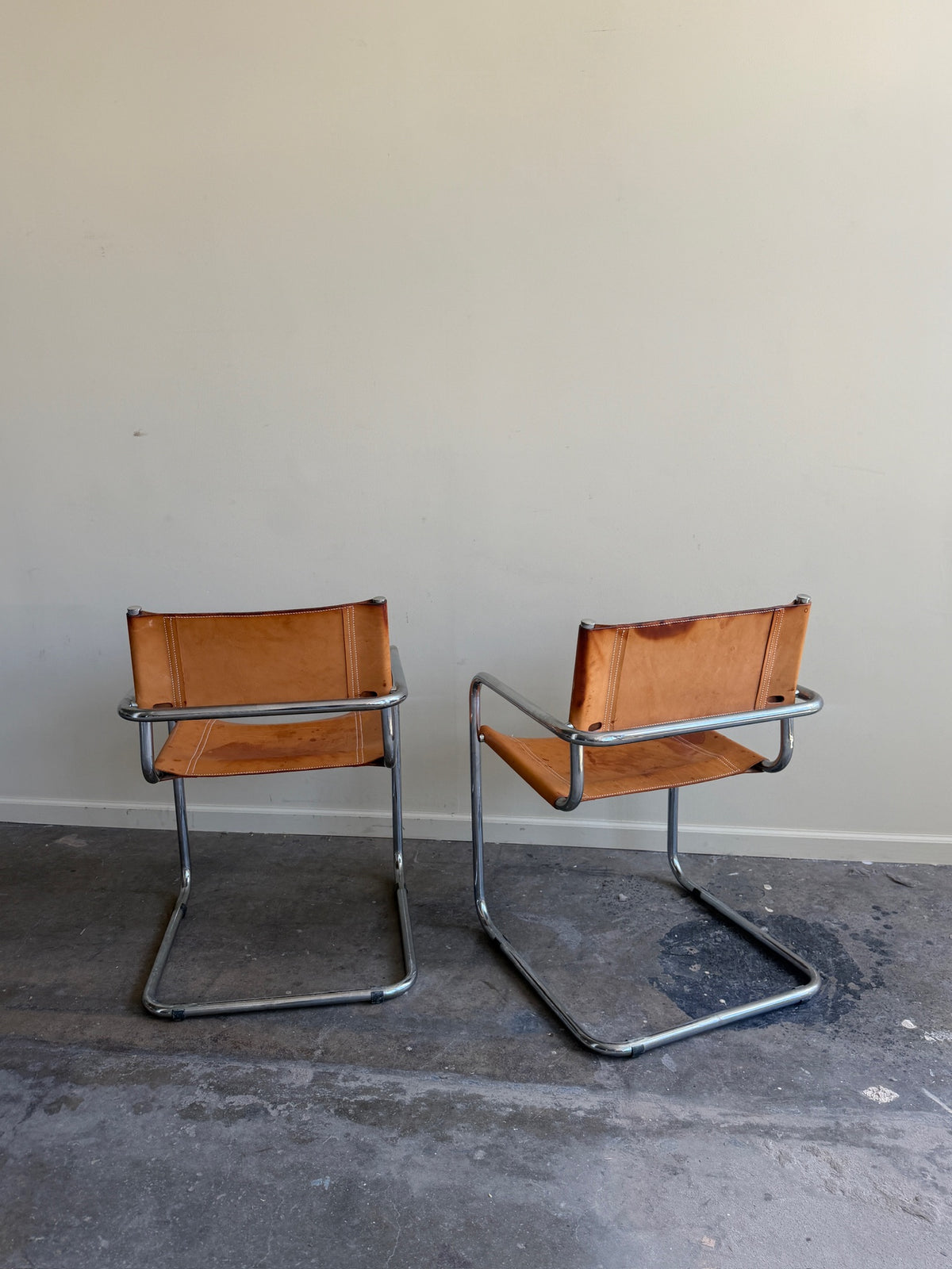 Chrome & leather armchairs. Sold individually.