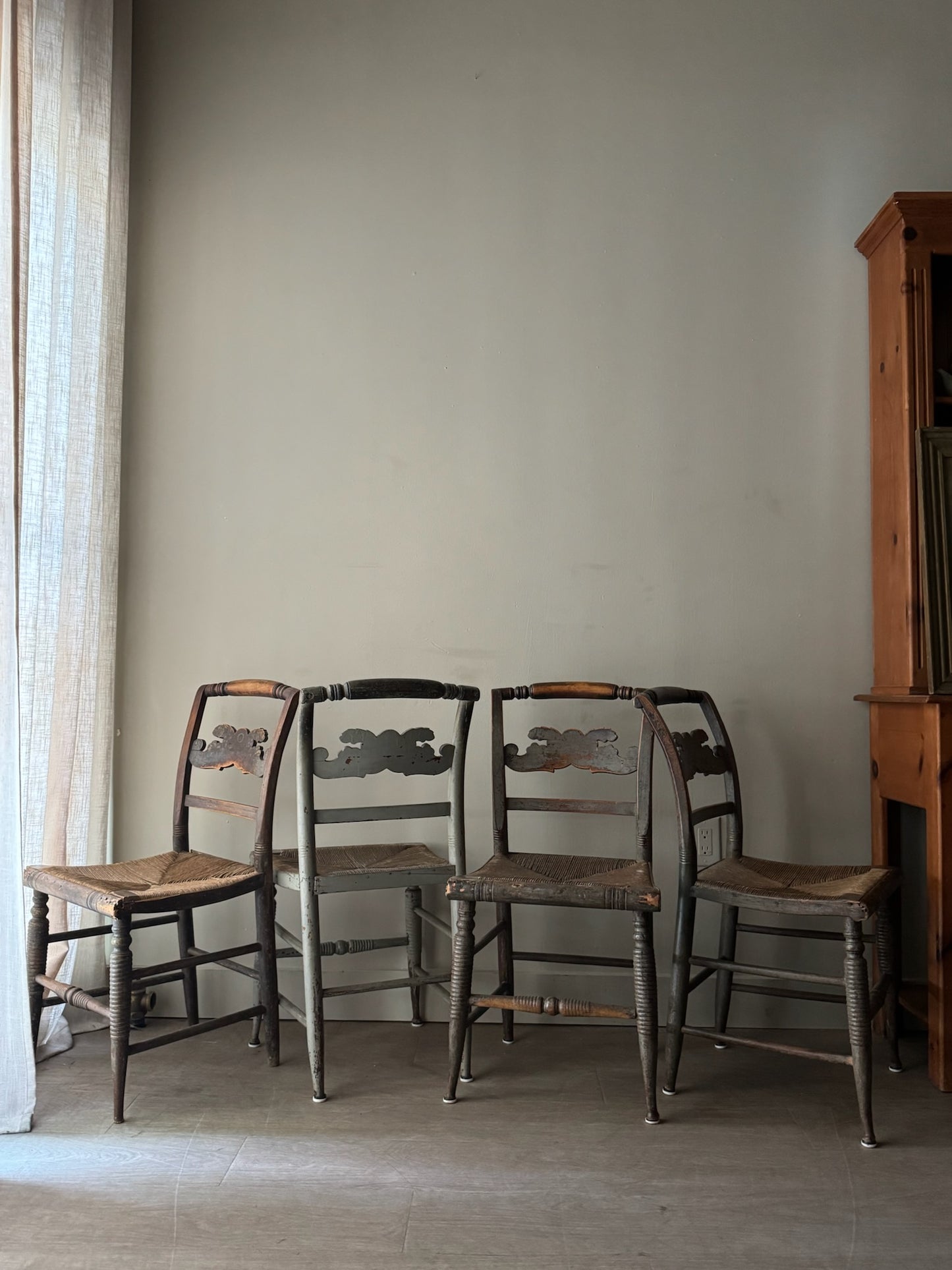 Carved dining chairs with rush seats. Sold in pairs.