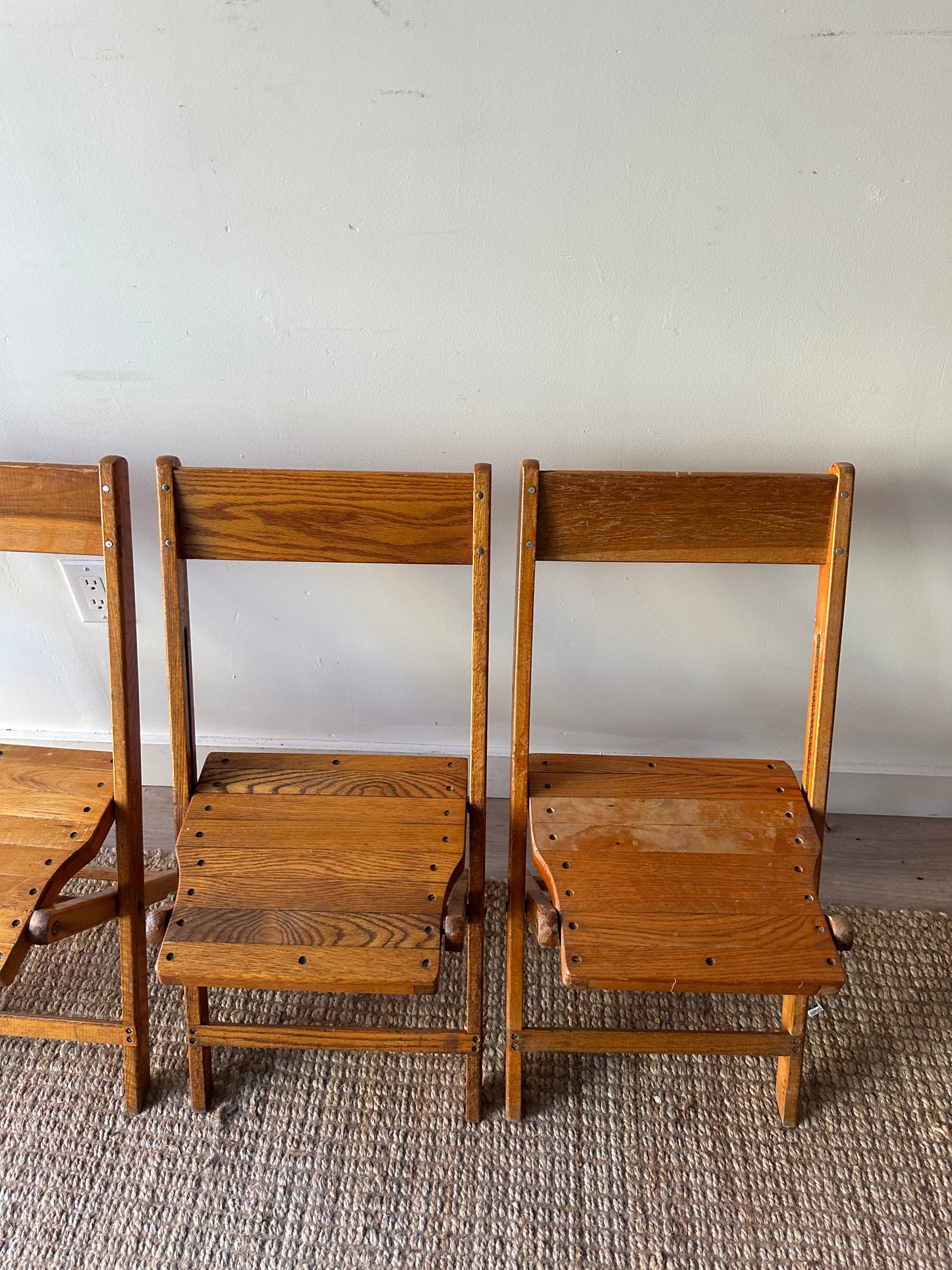 4 oak folding chairs. Sold individually.