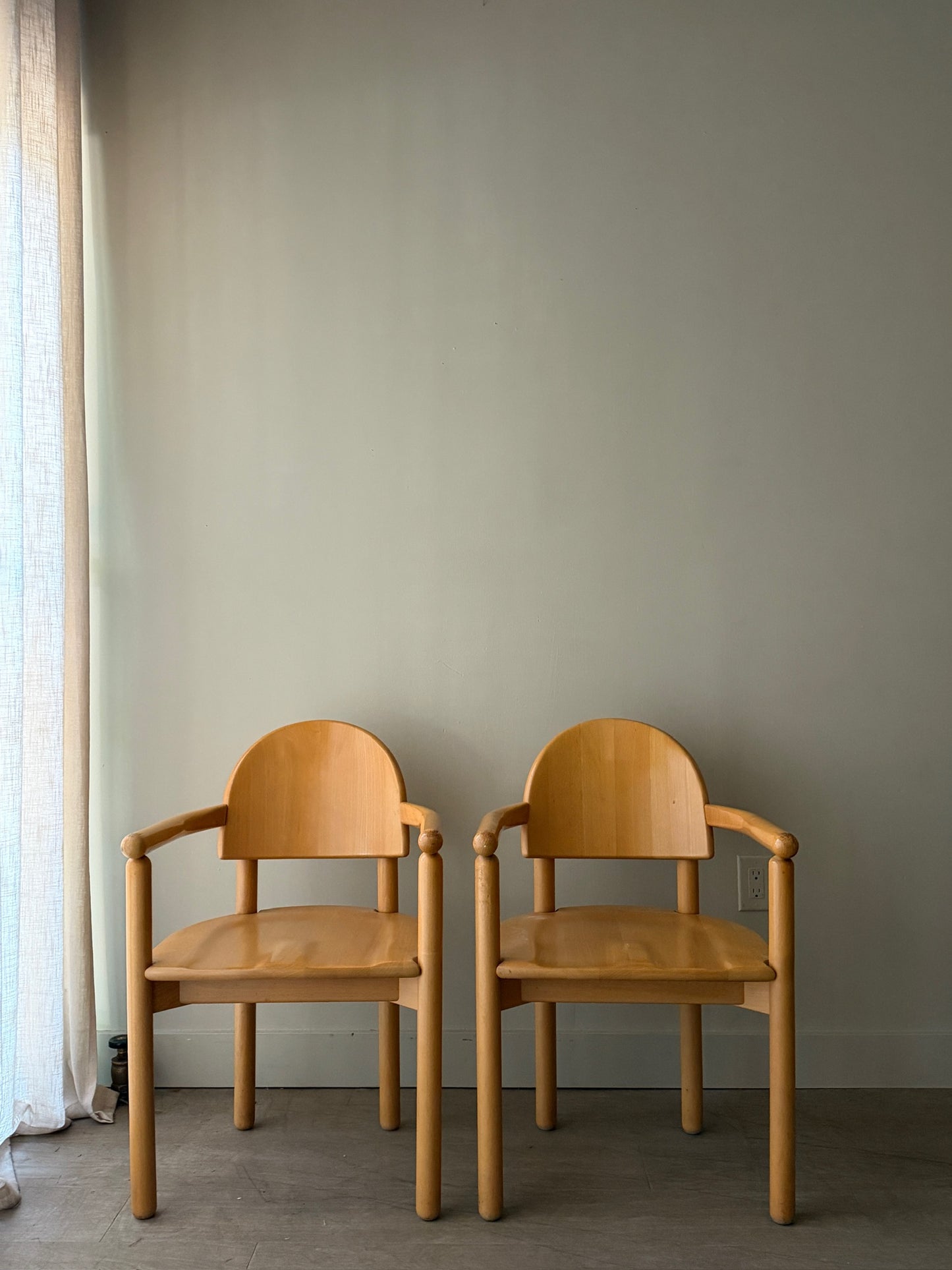 Rainer Daumiller pine dining chairs with arms. Sold individually.