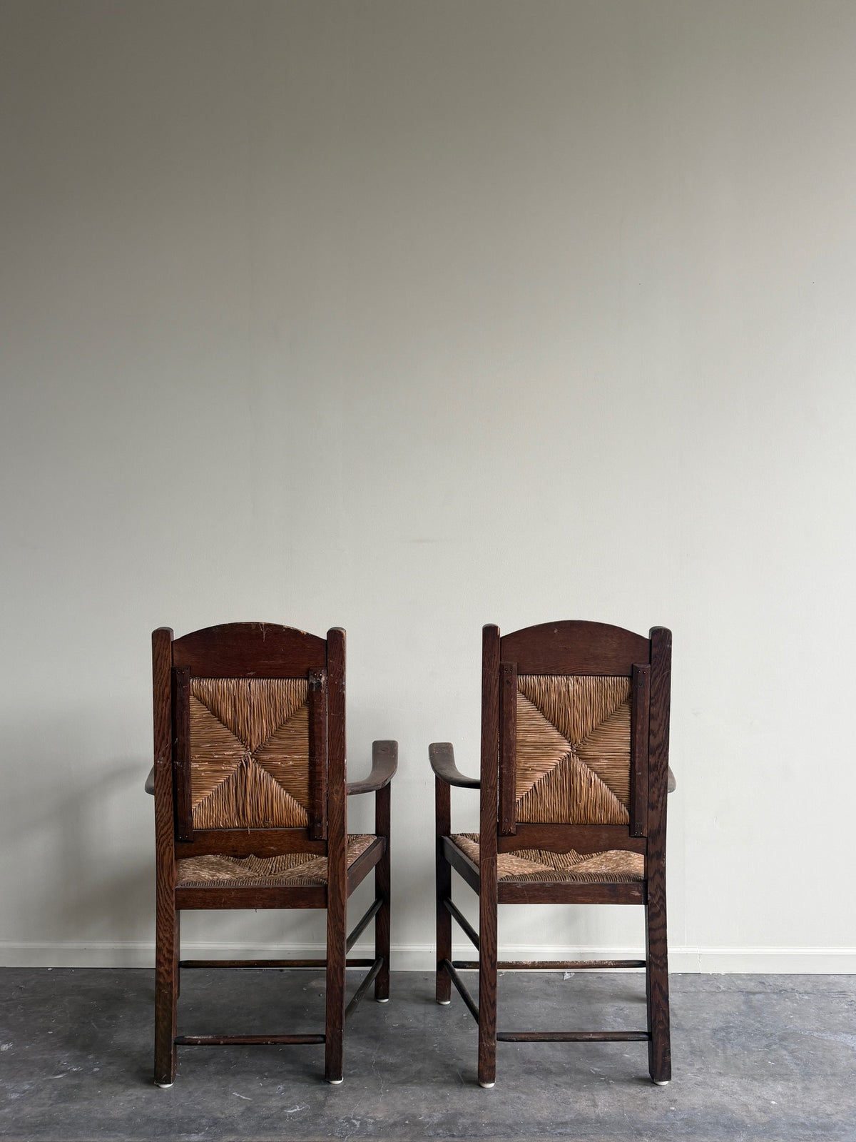 English provincial oak & rush armchairs. Sold individually.