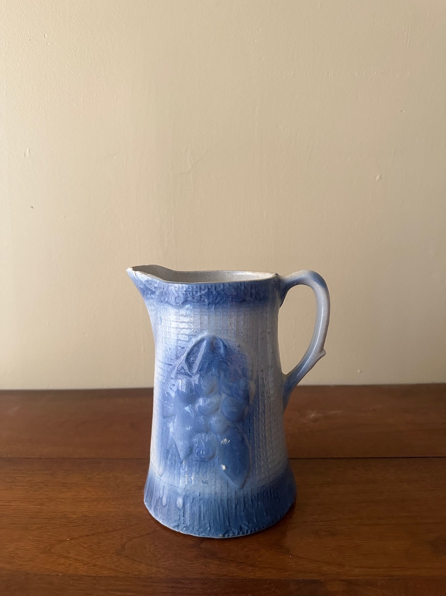 Salt glazed stoneware pitcher with fruit