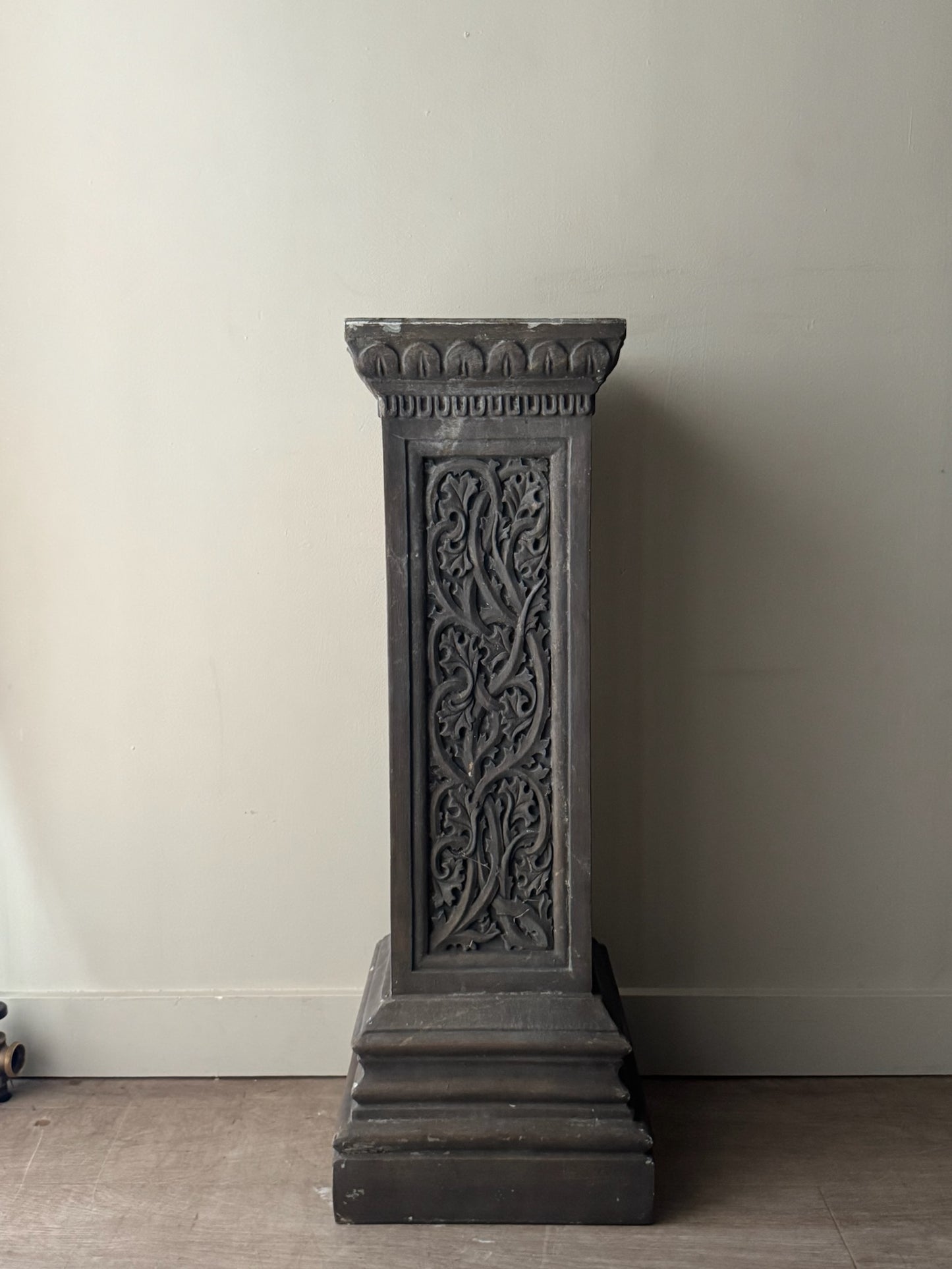 Carved pedestal