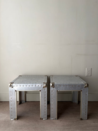 Riveted metal cocktail tables. Sold individually.