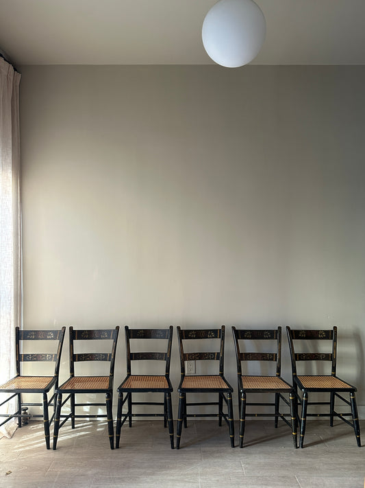 6 cane and black painted dining chairs. Sets of 2.