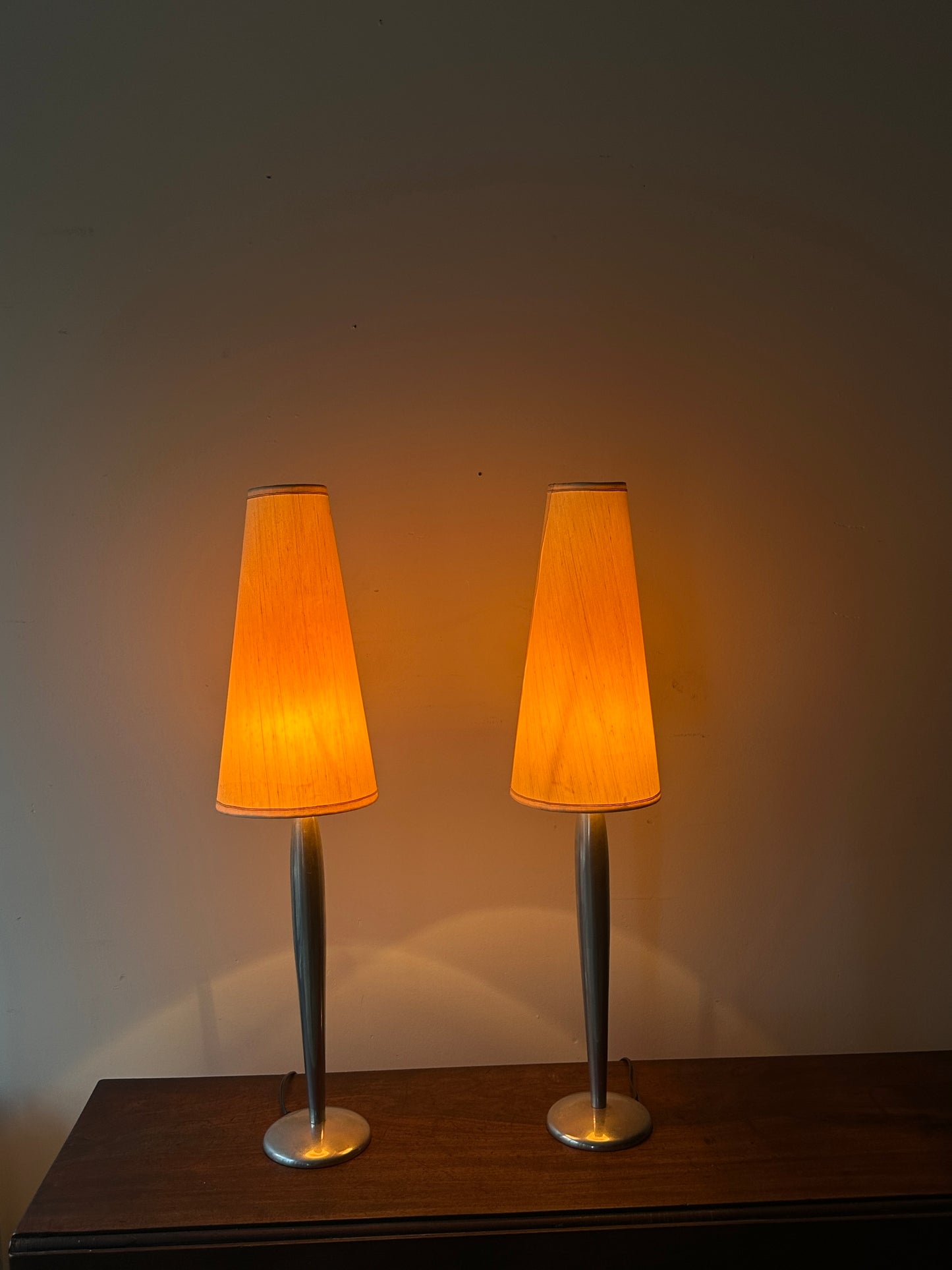 Lucien Gau Paris brushed crome table lamps. Sold as a pair.