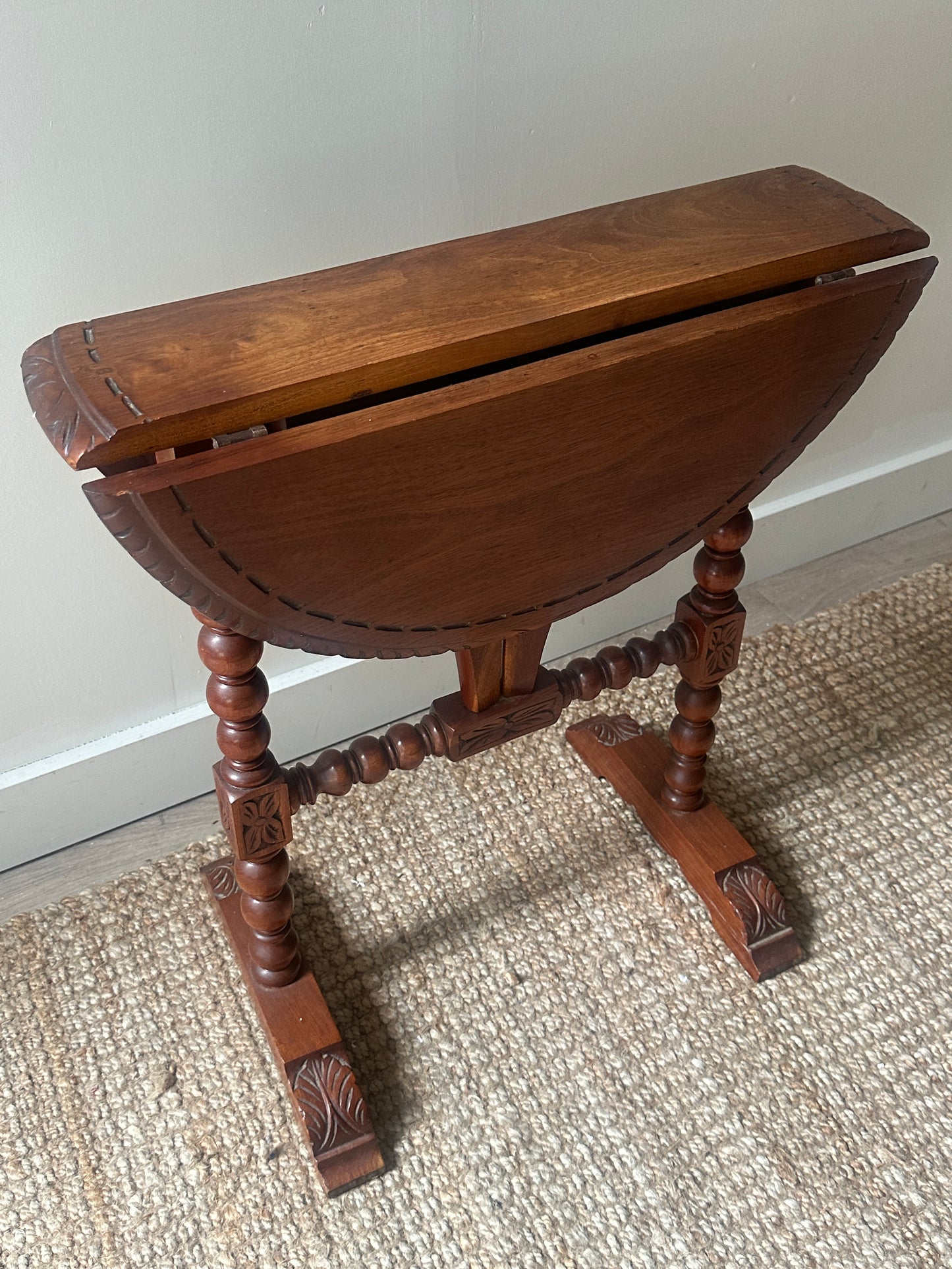 Carved drop leaf entryway table