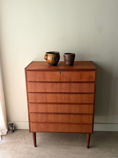 Danish teak tallboy dresser (left)