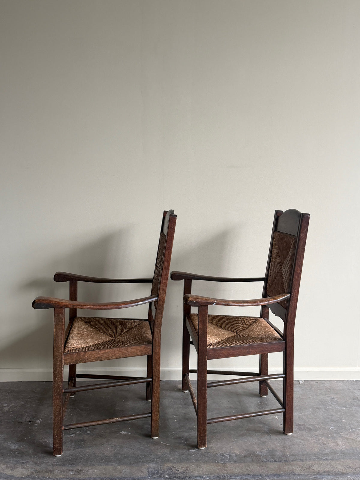 English provincial oak & rush armchairs. Sold individually.