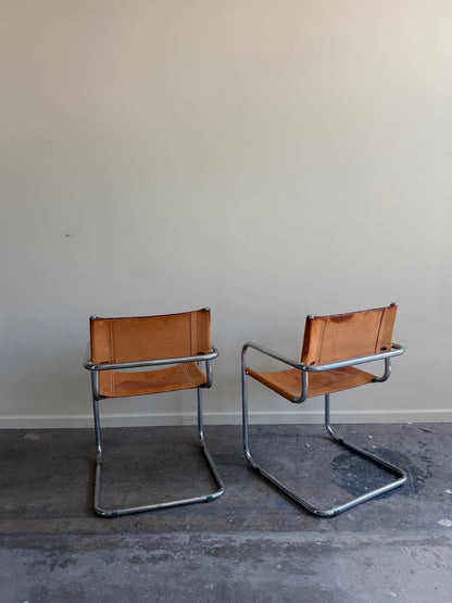 Chrome & leather armchairs. Sold individually.