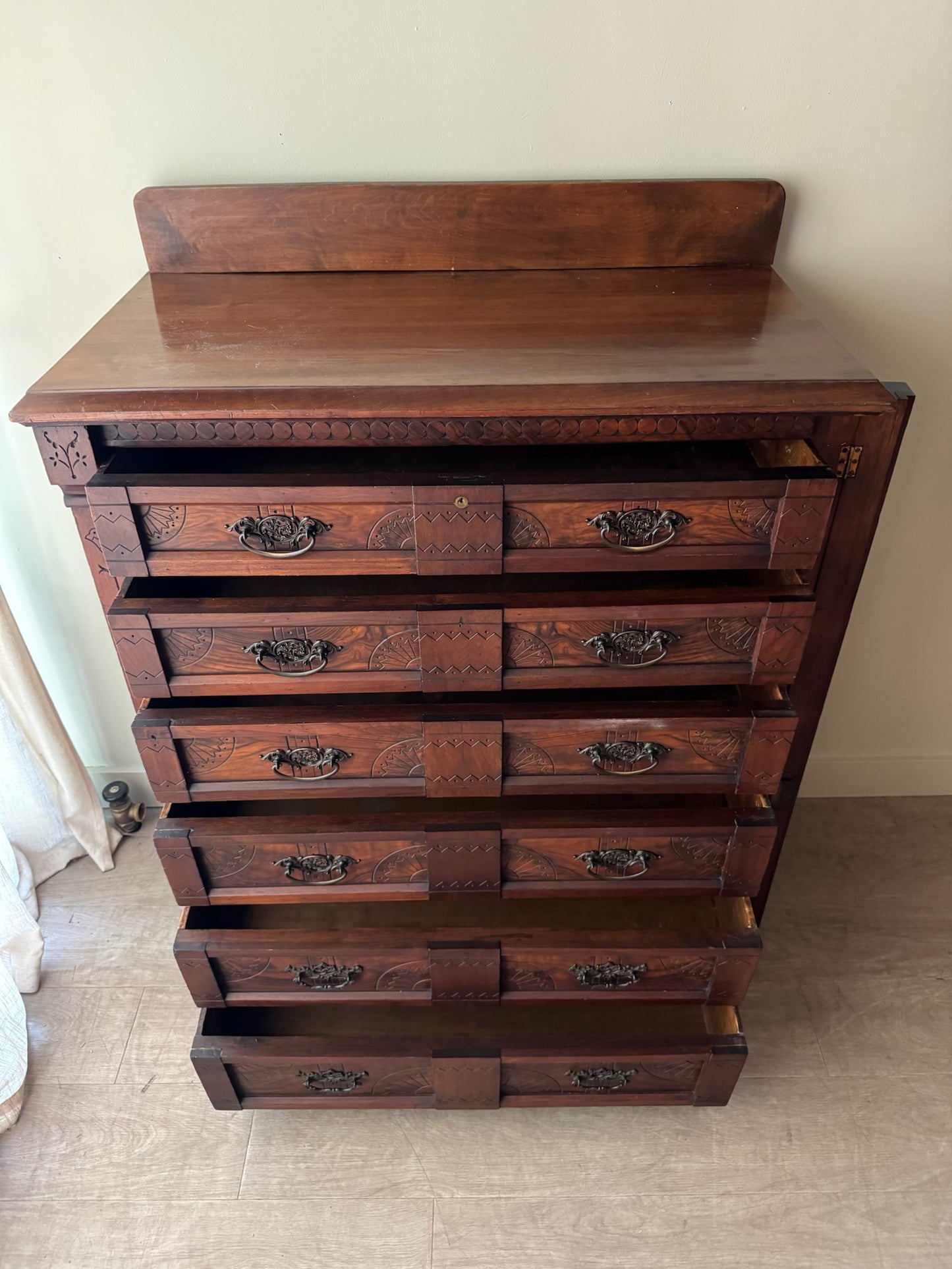 Carved Eastlake walnut dresser with side lock