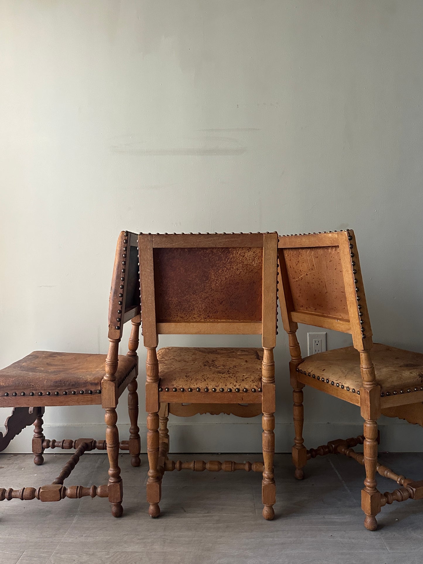 Leather and oak dining chairs. Sold individually.