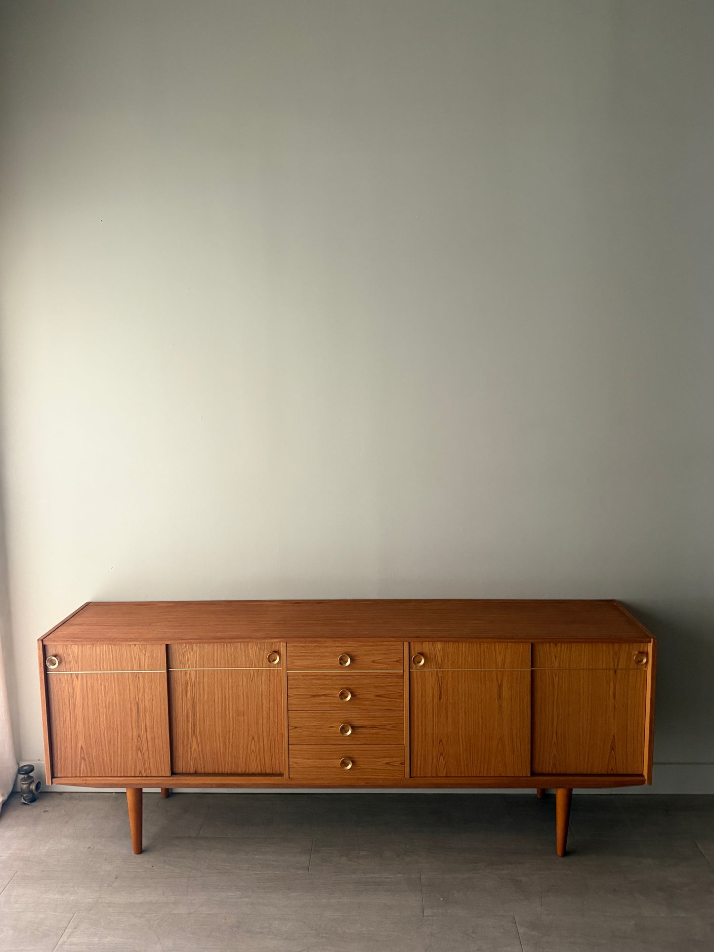 Danish teak sideboard with brass hardware