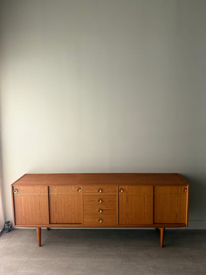 Danish teak sideboard with brass hardware