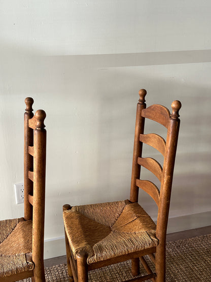 Pair of farmhouse ladder back chairs. Sold as a pair.