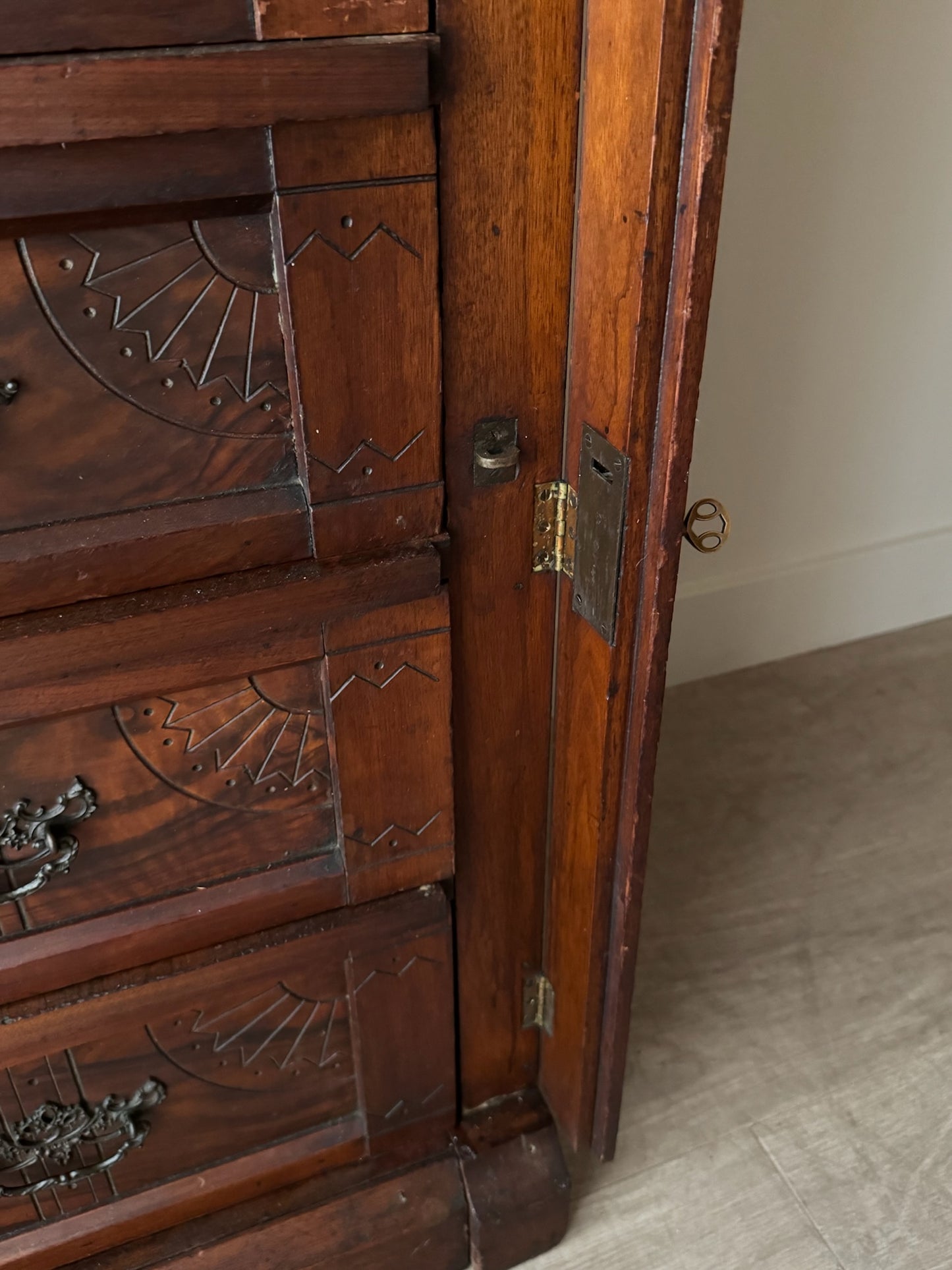 Carved Eastlake walnut dresser with side lock