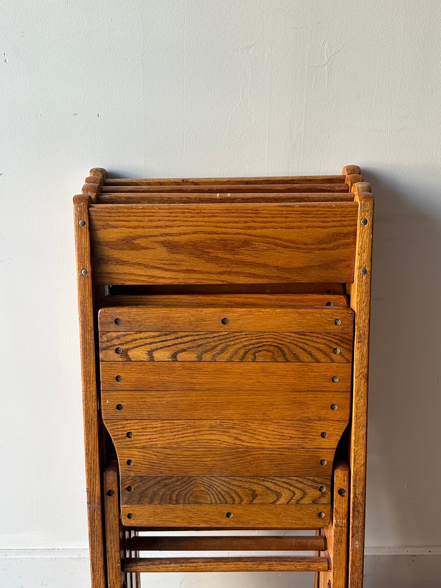 4 oak folding chairs. Sold individually.