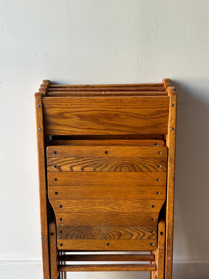 4 oak folding chairs. Sold individually.