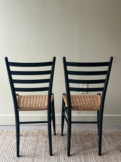 Pair of woven dining chairs. Sold as pair.