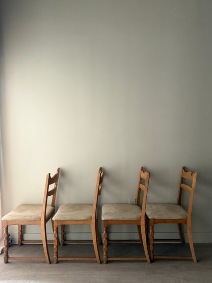 Danish oak dining chairs with suede upholstery. Sold in pairs.