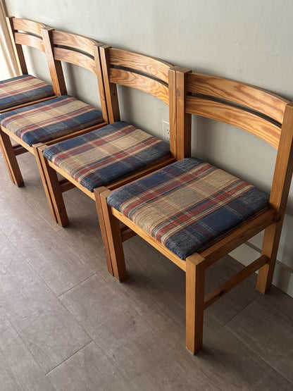 Danish pine plaid upholstered dining chairs. Sold in pairs.