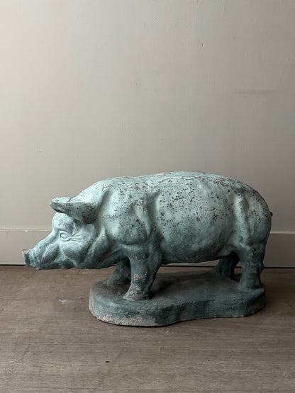 Light blue painted concrete pig