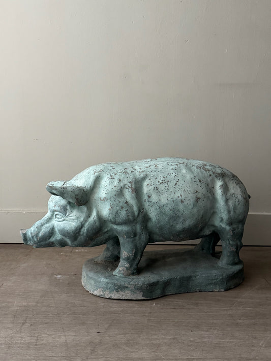 Light blue painted concrete pig