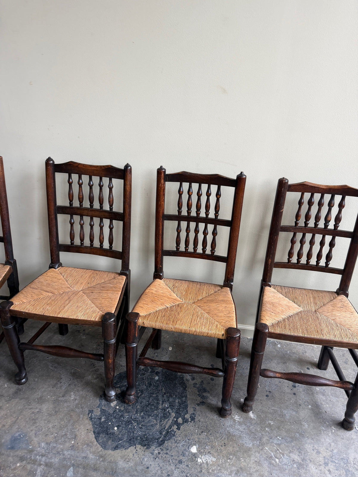 Dutch oak spindle back rush seat dining chairs. Sold in pairs.