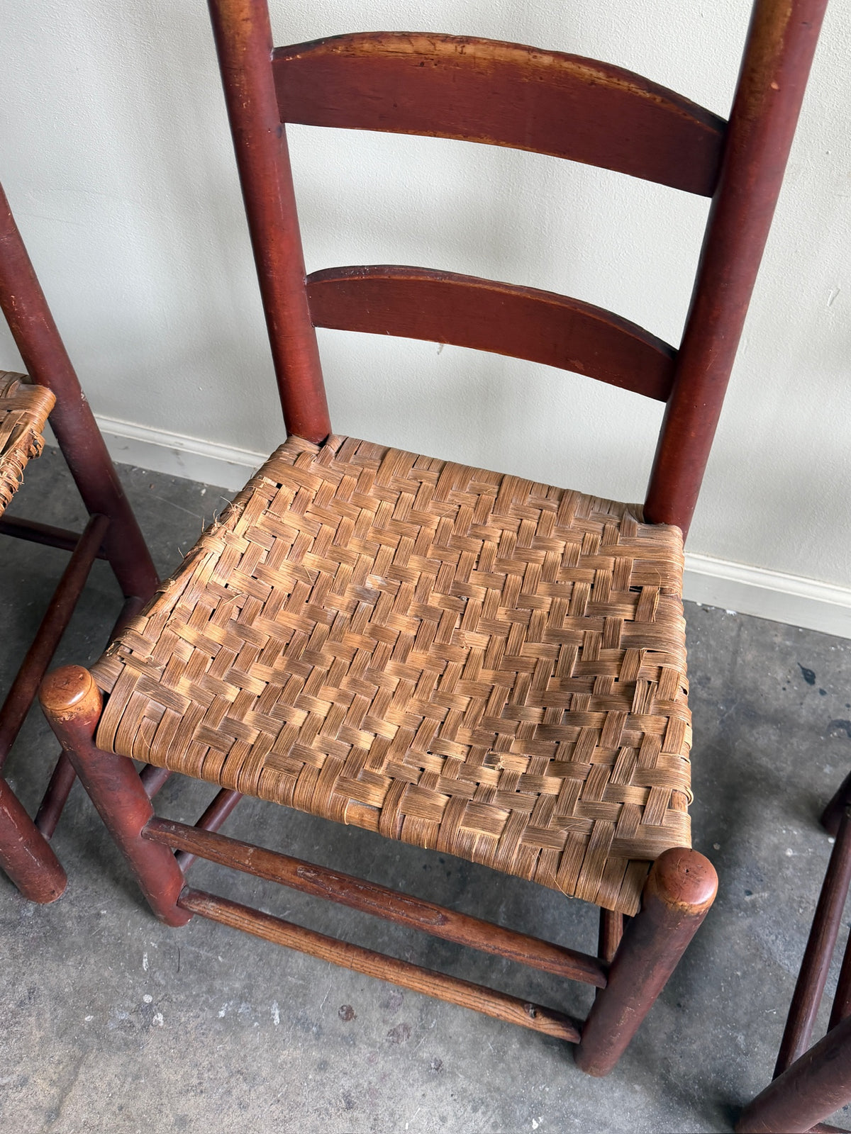 Pennsylvania painted maple ladder back chairs. Sold in pairs.