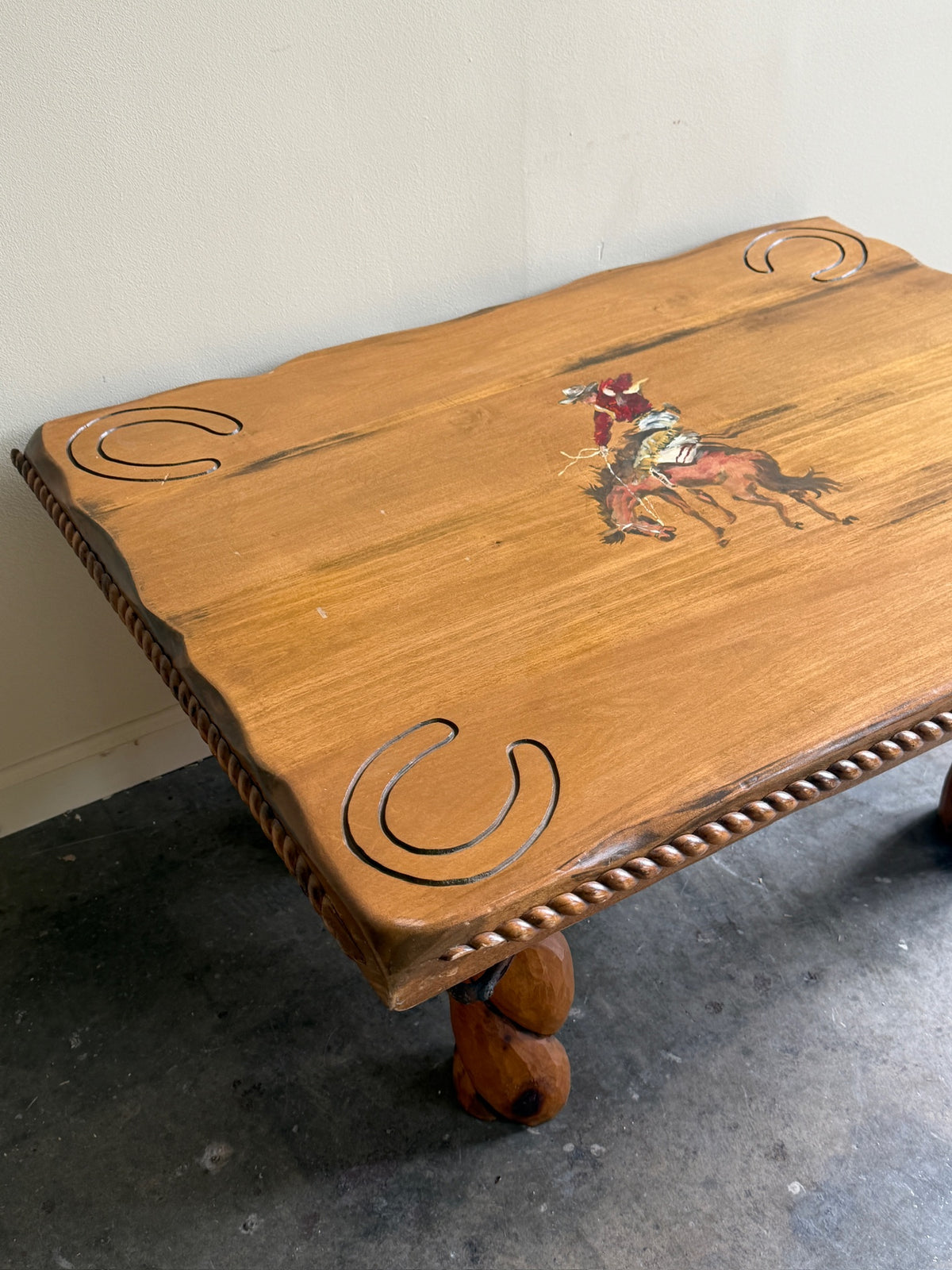 Pine coffee table with equestrian motifs