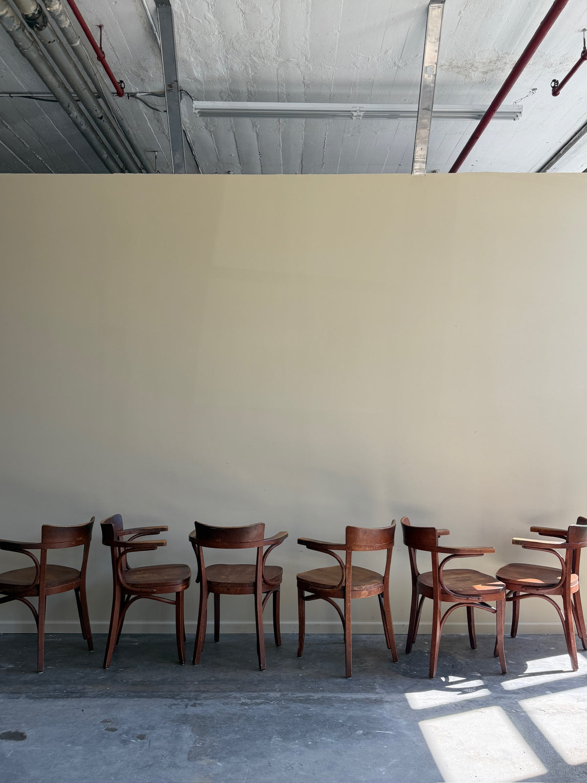 Thonet bentwood arm chairs. Sold in pairs.