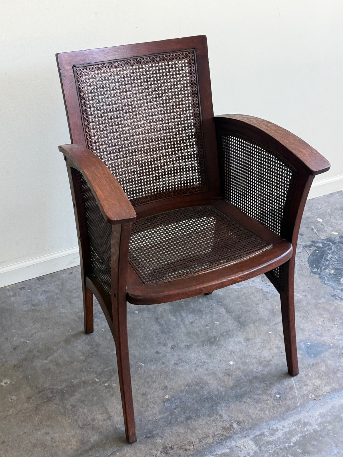 Golden oak caned armchair