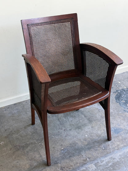 Golden oak caned armchair