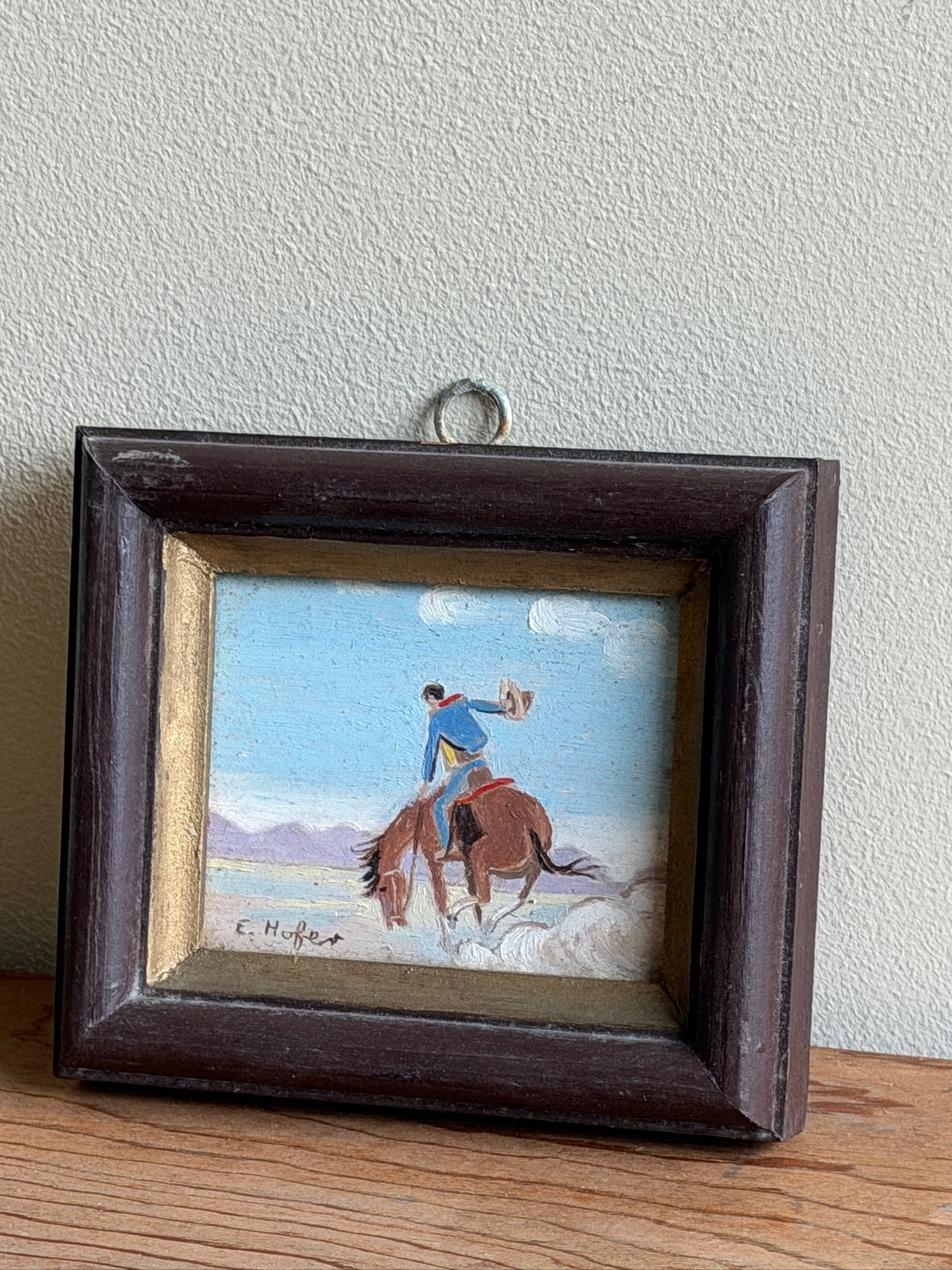 Small cowboy oil painting by E. Hofer