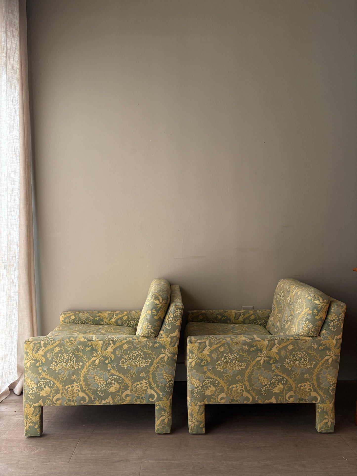 Directional green floral upholstered lounge chairs. Sold individually.